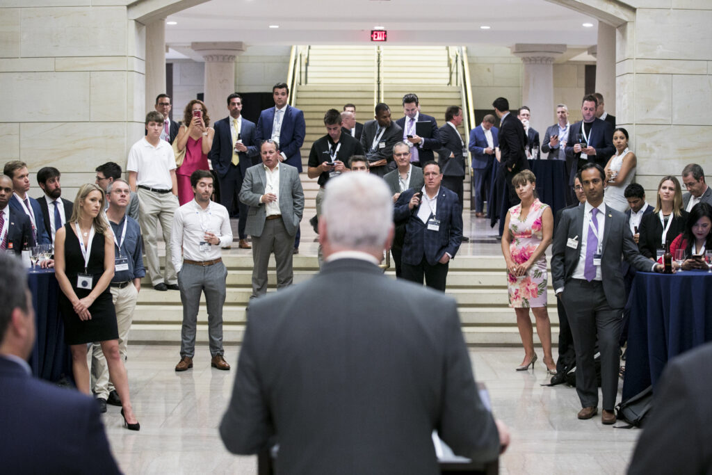 Olga Mack speaking with legislators in Washington, D.C. about transformative and disruptive technology.